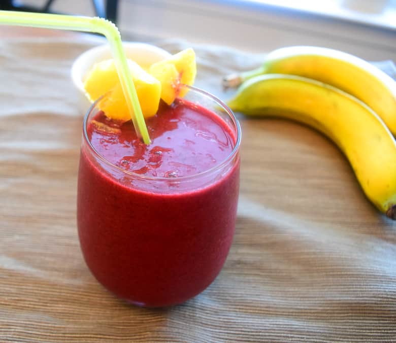 Beet Banana Smoothie with mango served in wine glass