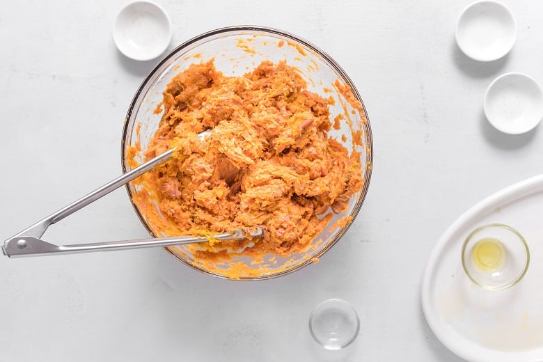 Mashed sweet potato in a bowl for ground turkey and sweet potato burger recipes