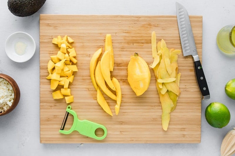 Mango slices on cutting board