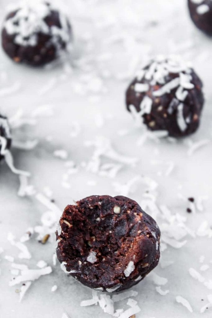 close up of easy chocolate fudge bites with coconut flakes