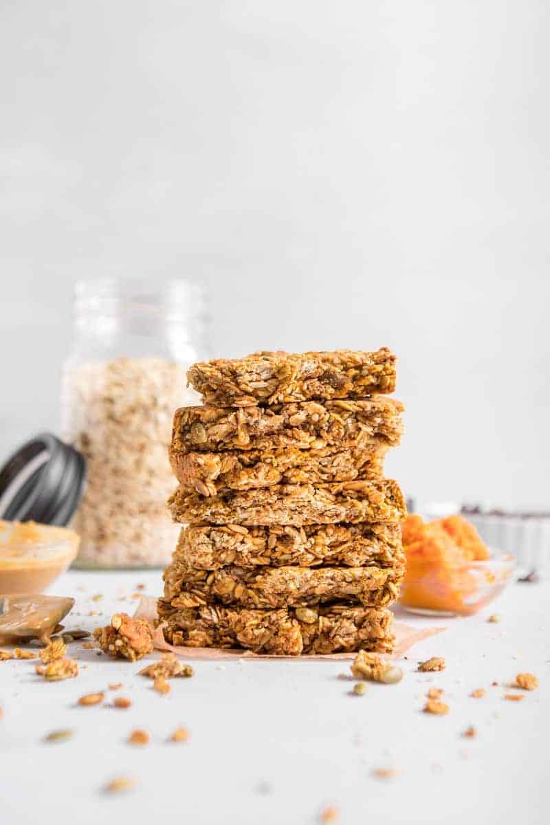 Stacked Vegan Hemp Protein Barsth oats in background