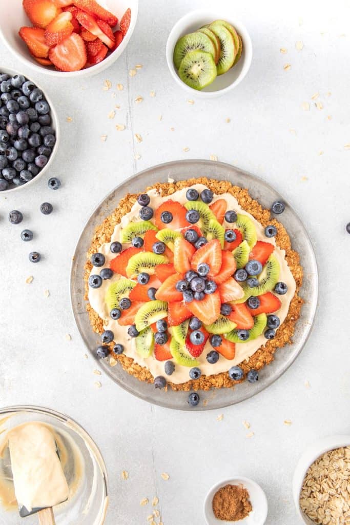 overhead of healthy Fruit pizza recipe topped with fresh berries and greek yogurt yogurt | Bucket List Tummy