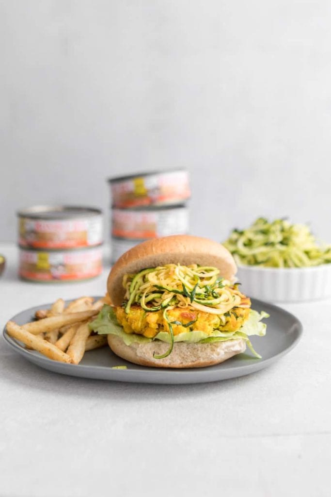 zucchini and canned salmon burger on an open faced bun