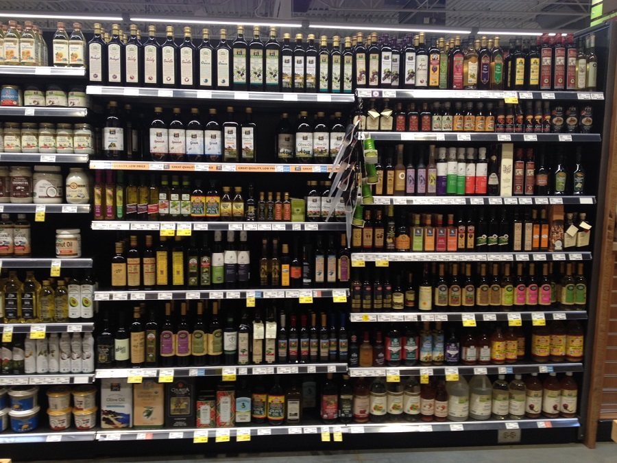 Olive oil and dressings in aisle in Whole Foods