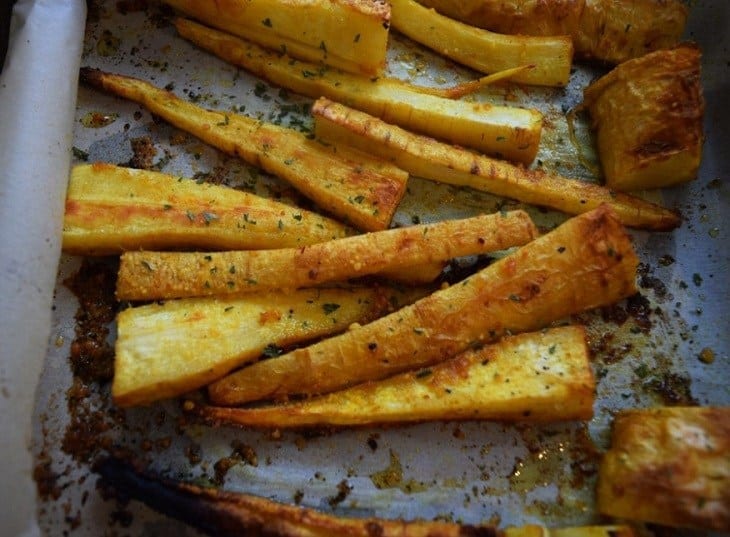 Baked Turmeric Parsnip Fries are crispy and sprinkled with cheese. An easy parsnip fries recipe that is delicious and a quick side to any meal | Oven roasted parsnip fries