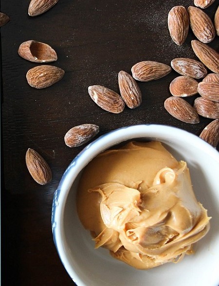 almonds with scoop of peanut butter
