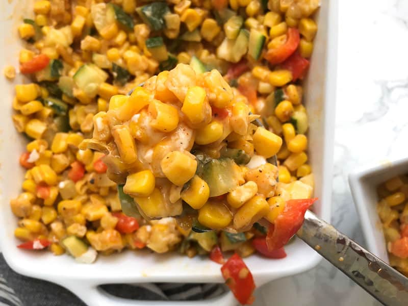 closeup of cheesy mexican street corn dip on spoon | Bucket List Tummy