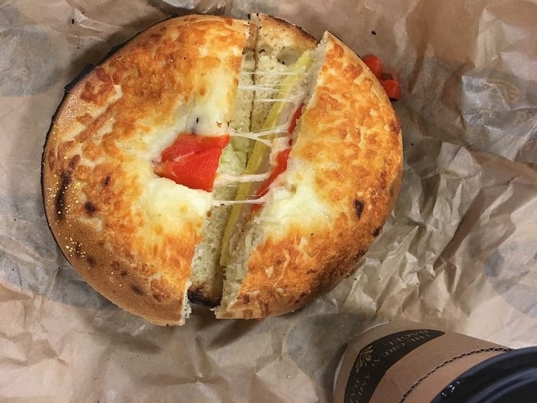 breakfast bagel with cheese in wrapping