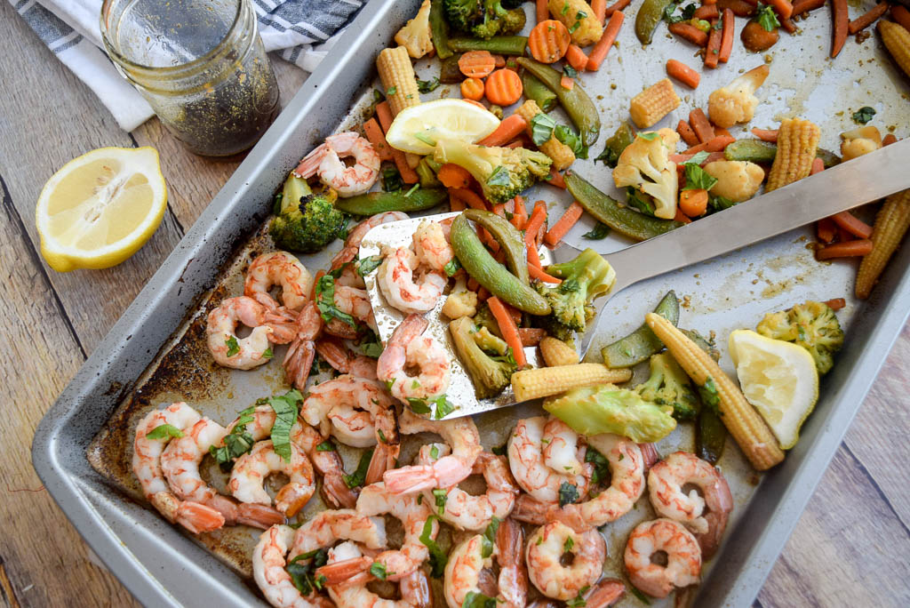 20 minute honey shrimp sheetpan meal with vegetables on baking sheet 