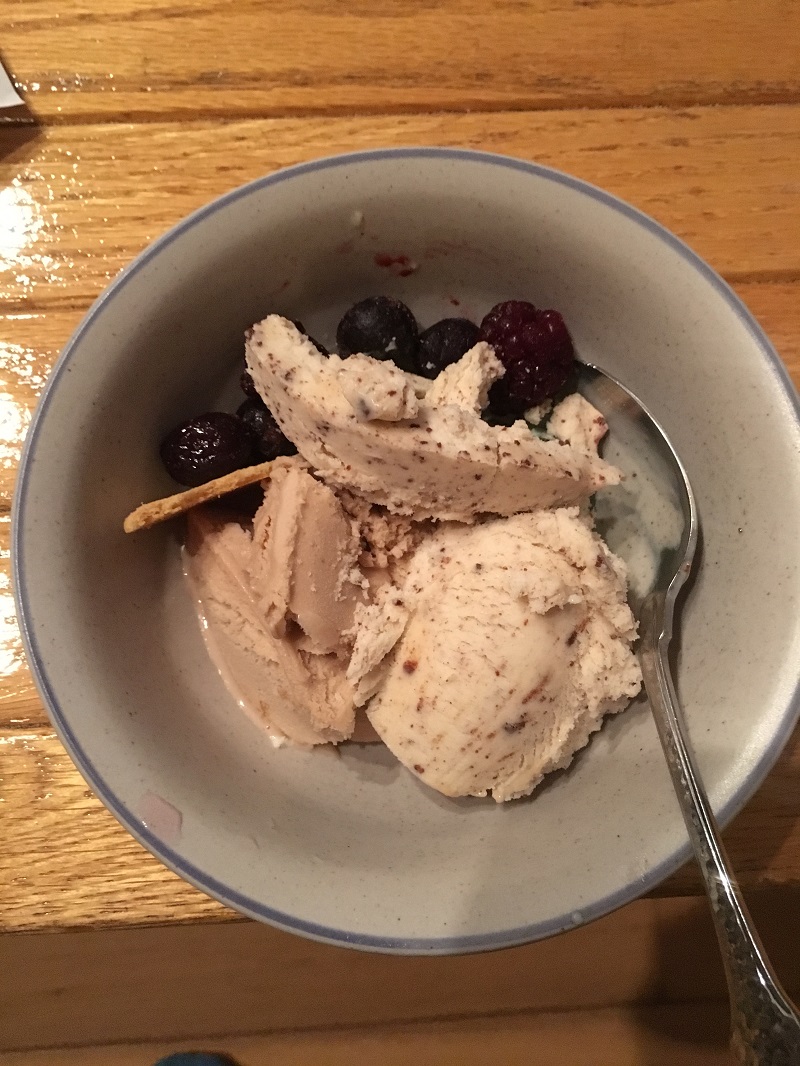 bowl with ice cream, frozen fruit and crackers