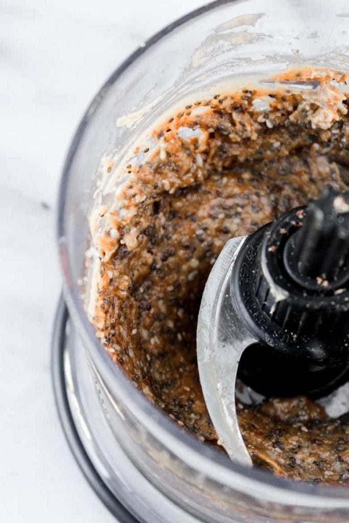 food processor with mixture for chia peanut butter balls