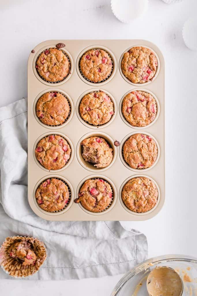 overhead shot of strawberry banana chickpea flour muffins in muffin tin | Bucket List Tummy
