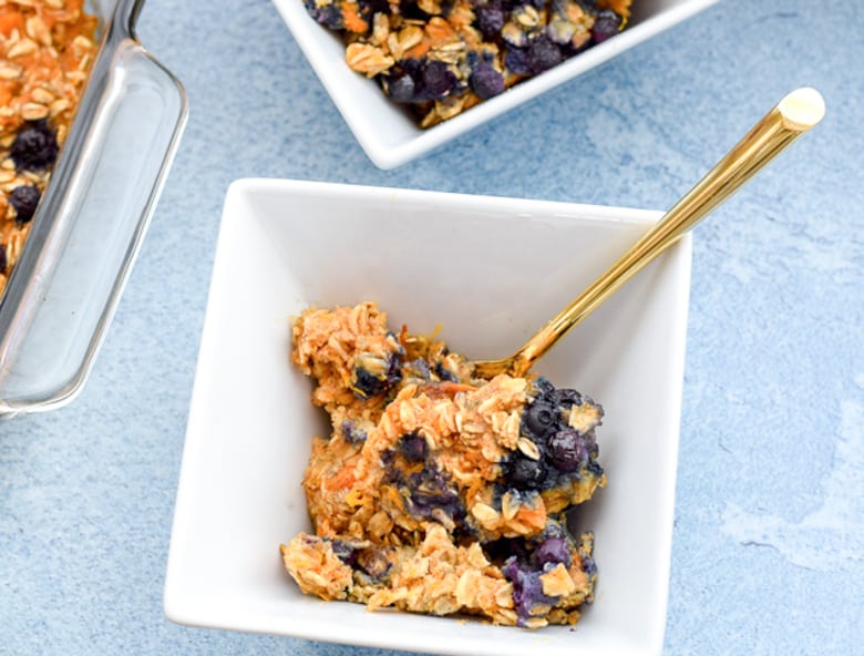sweet potato oatmeal with blueberries in white bowl | Bucket List Tummy