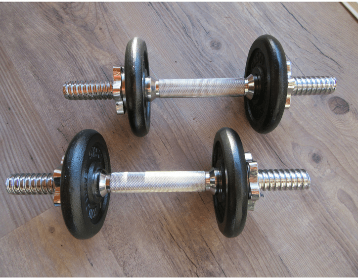 dumbbell weights on wooden floor