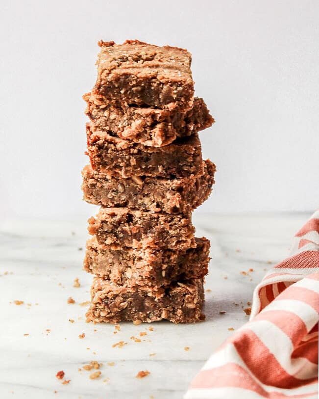 Stack of vegan protein bars made with chickpeas on white background | Bucket List Tummy