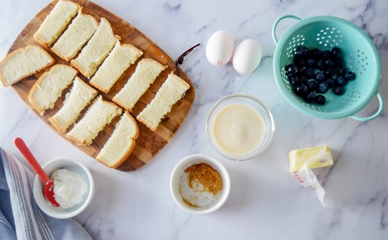 Baby French Toast ingredients: bread, eggs, milk, blueberries, butter