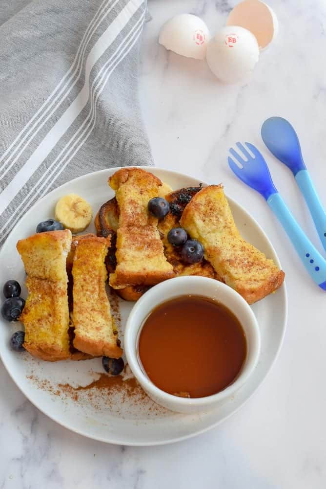 Serving french toast to a baby for baby led weaning