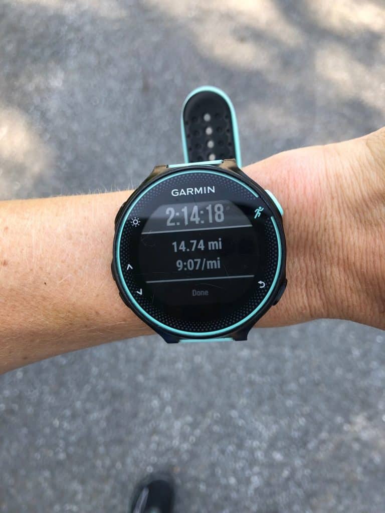 Garmin watch on wrist after doing 14 miles