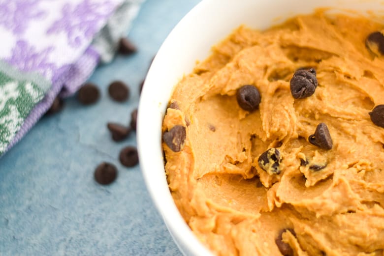close up of sweet potato vegan cookie dough recipe in white bowl with chocolate chips on side | Bucket List Tummy