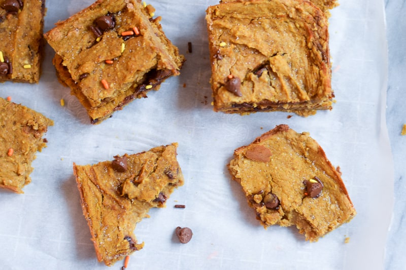 Overhead view of healthy pumpkin bars on parchment paper