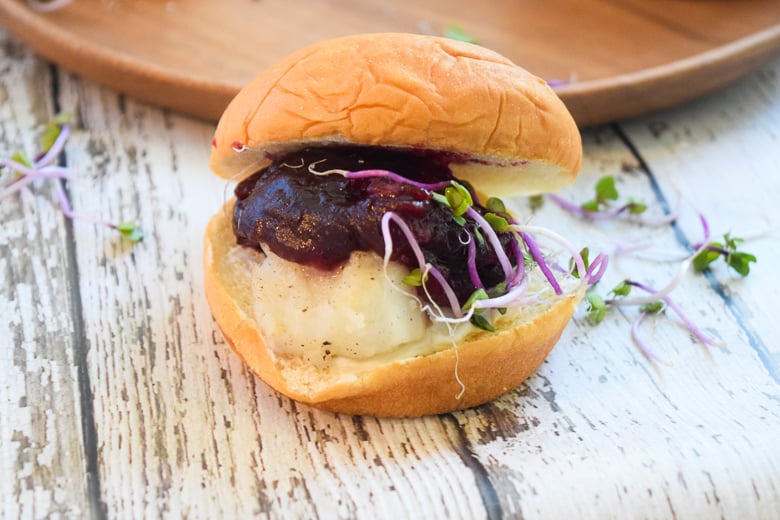 Alaska Cod Slider with Cranberry Suace closeup on wooden surface