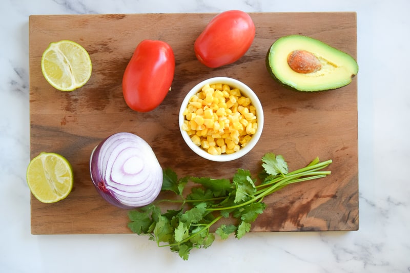 Ingredients for Avocado Tomato Salsa on cutting board
