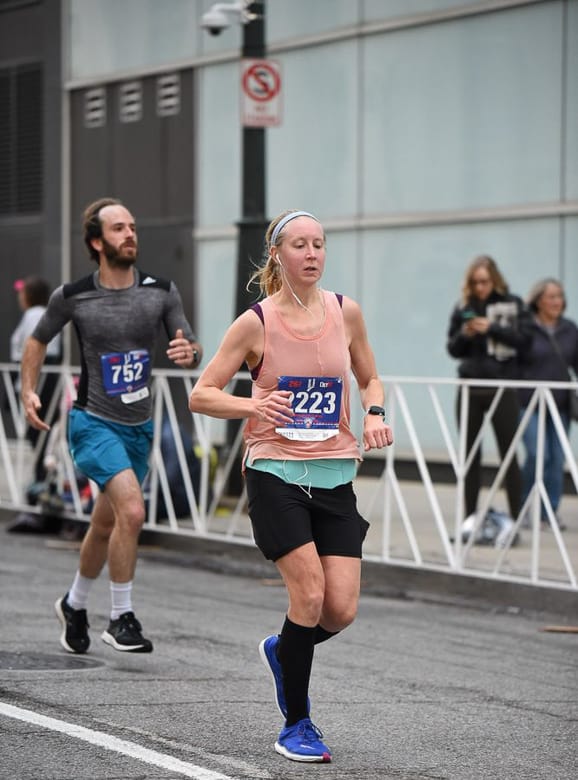 woman running Detroit Free Press Marathon 2019