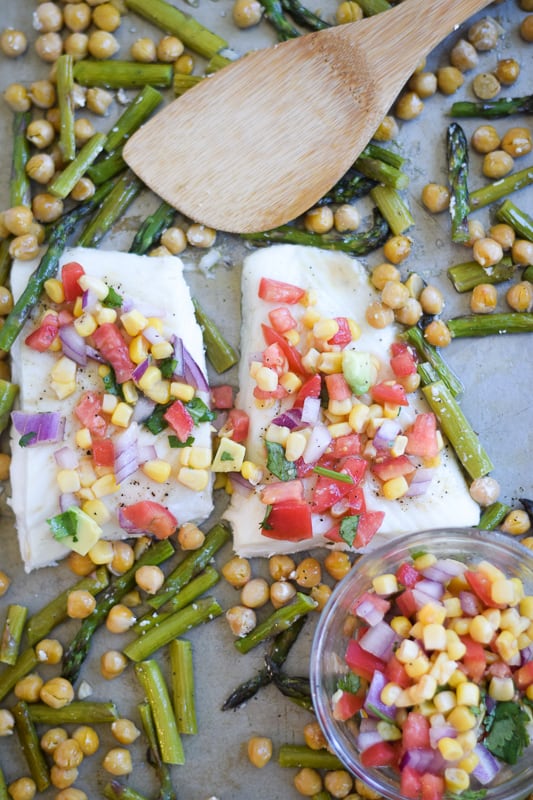 Alaskan Halibut on Sheet Pan with Chickpeas and Asparagus topped with avocado tomato corn salsa