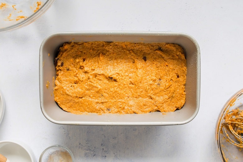 Mixing bowl of wet ingredients for sweet potato bread on gray background | Bucket List Tummy