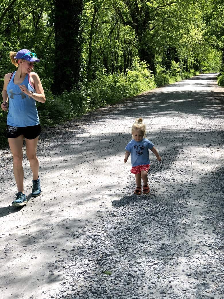 pregnant mom running with toddler