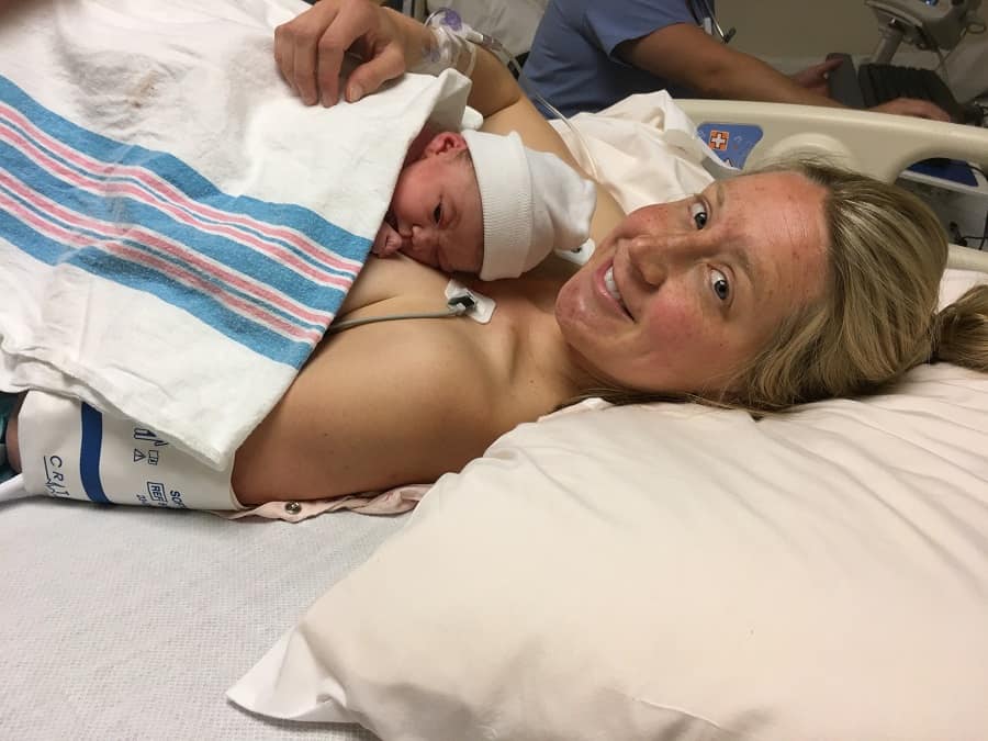 holding baby after giving birth