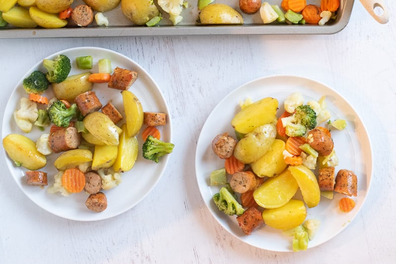 chicken sausage, potatoes and veggies on white plates
