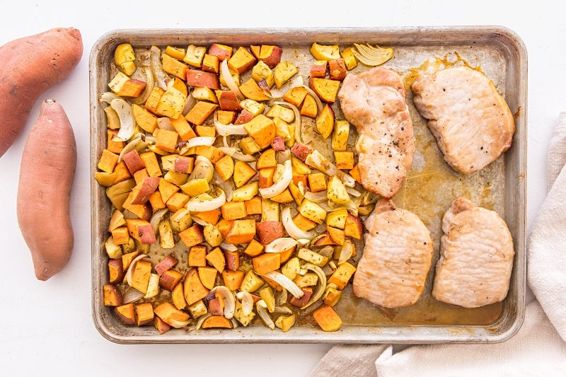 pork chops and sweet potatoes onions and apples on sheet pan
