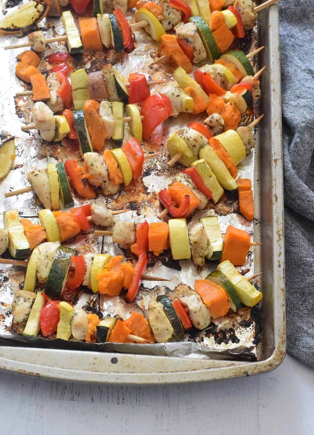 baking pan with chicken kebabs baked in the oven 