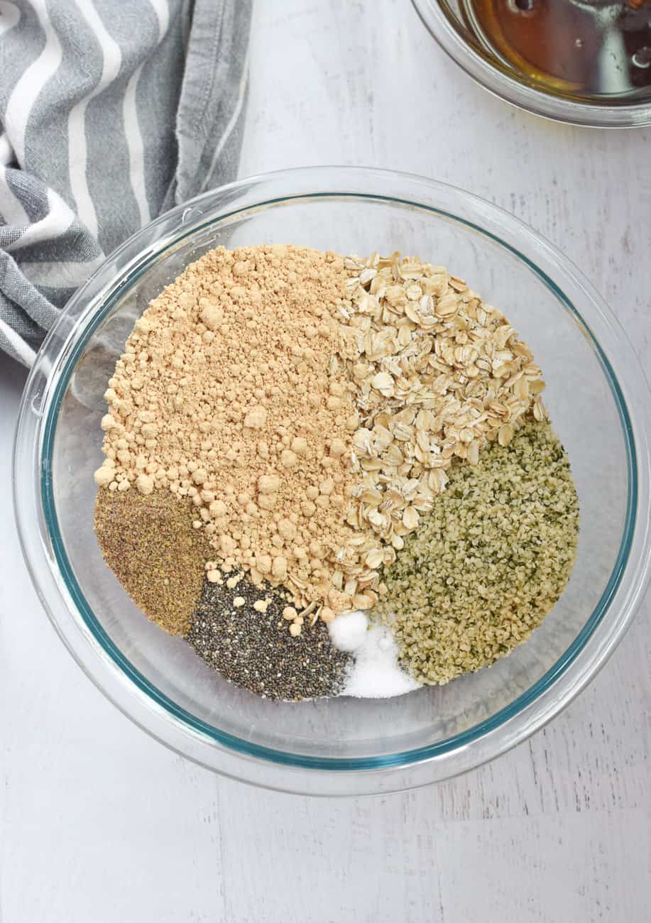 clear bowl with ingredients for hemp seed granola