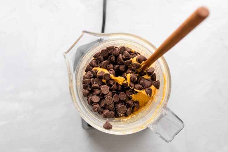 healthy vegan cookie dough in food processor with chocolate chips