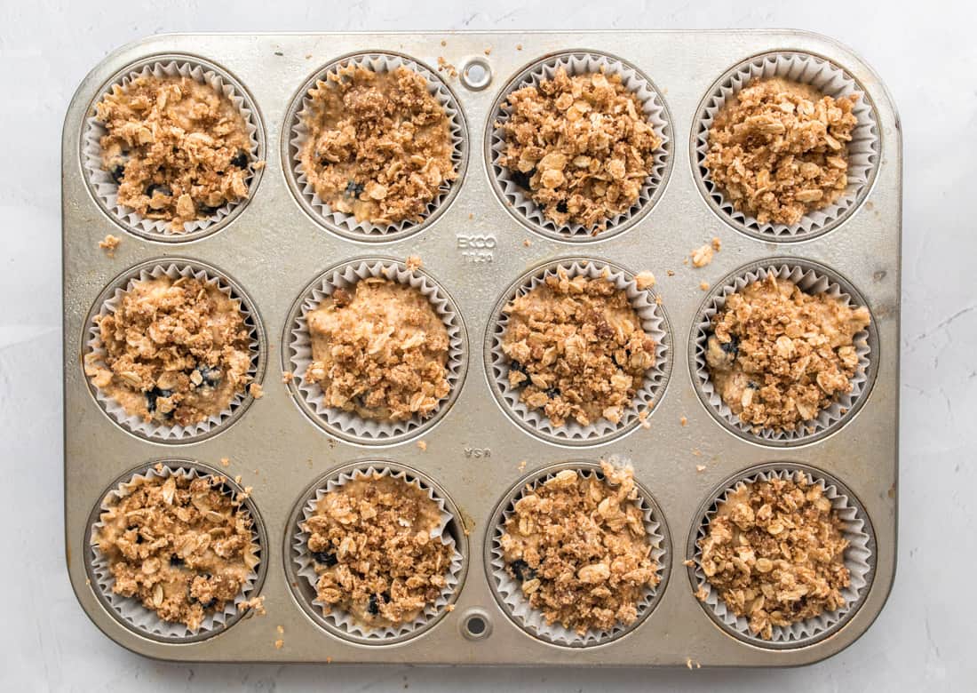 muffins with gluten free streusel topping in muffin pan