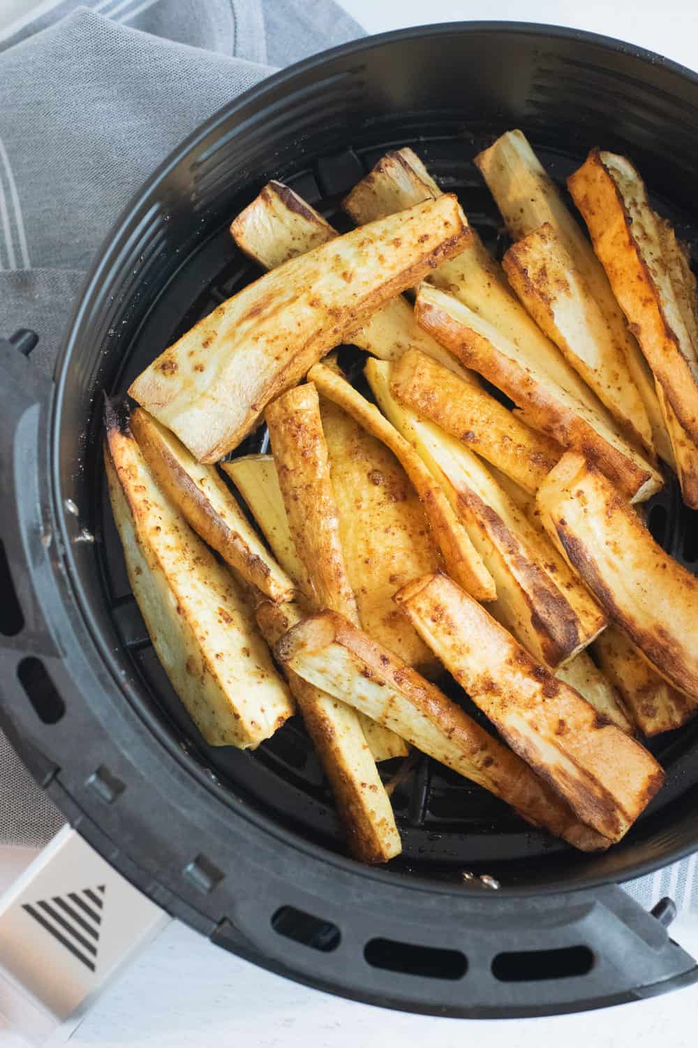 closeup of roasted parsnips in the air fryer