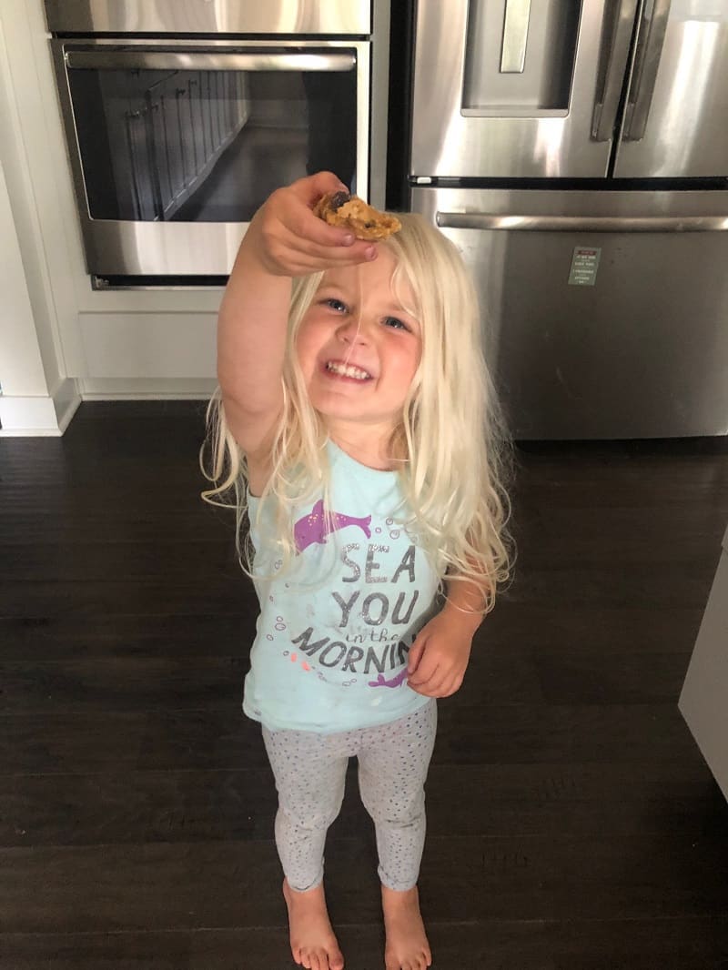 toddler holding frozen cookie dough bite